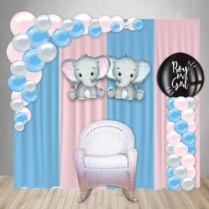 Gender reveal decorations with a backdrop, custom cutout, organic balloon arch, balloon pop on a column, and white rocking chair.