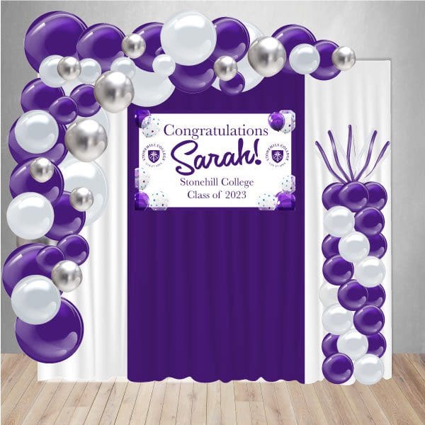 Graduation Decor Package 6 includes a curtain backdrop, organic balloon arch, balloon column, and personalized banner.