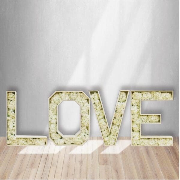 Our beautiful LOVE Marquee letters filled with off-white flowers are a beautiful addition to your wedding or shower.