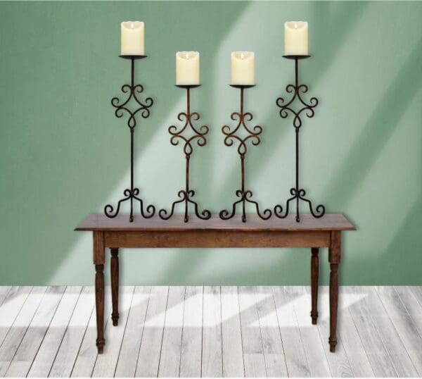 Our Wrought Iron Candle Holders come in 2 different sizes, quantity 4, have a chargeable flameless candle, and are the perfect accent elements to add to any design decor!